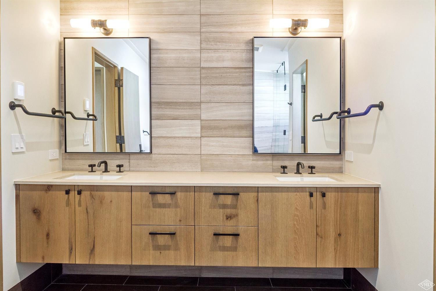 304 Bridge Street, Unit R3 Vail, CO 81657 - Photo 16 of 25 a bathroom with a sink and a mirror
