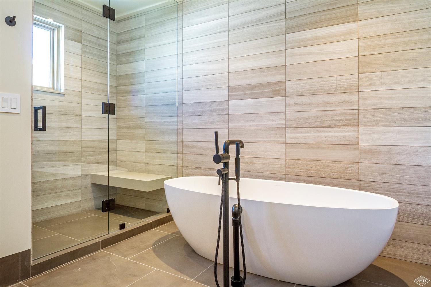 304 Bridge Street, Unit R3 Vail, CO 81657 - Photo 17 of 25 a white bath tub sitting in a bathroom