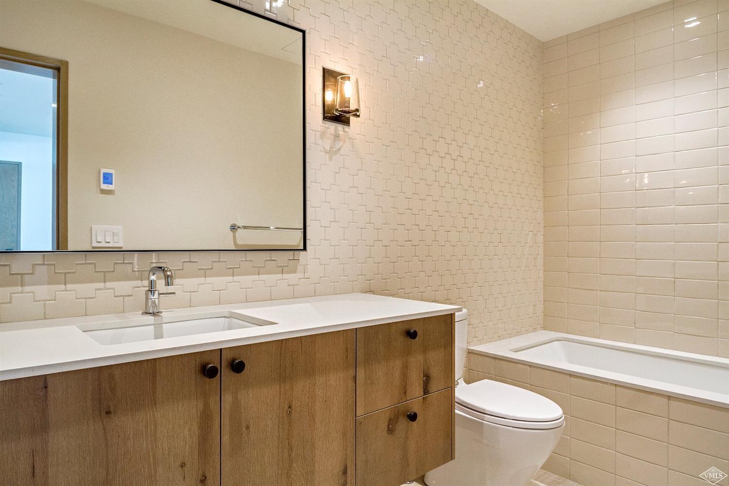 304 Bridge Street, Unit R3 Vail, CO 81657 - Photo 19 of 25 a bathroom with a sink and a mirror