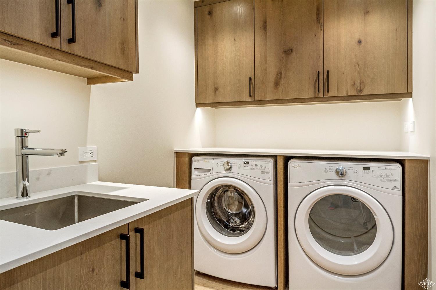 304 Bridge Street, Unit R3 Vail, CO 81657 - Photo 25 of 25 a utility room with sink dryer and washer