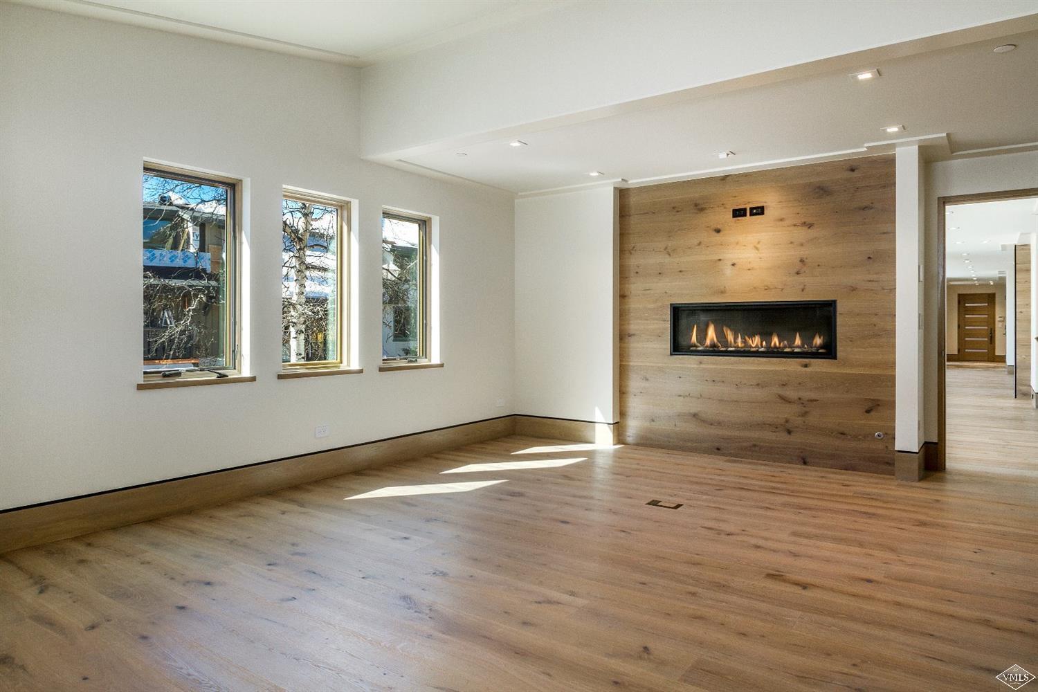 304 Bridge Street, Unit R3 Vail, CO 81657 - Photo 10 of 25 a view of an empty room with window and wooden floor