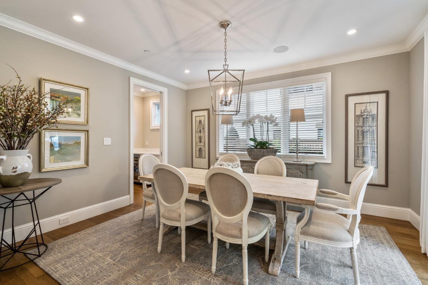 115 Occidental Avenue Burlingame, CA 94010 - Photo 12 of 50 a dining room with furniture a chandelier and wooden floor