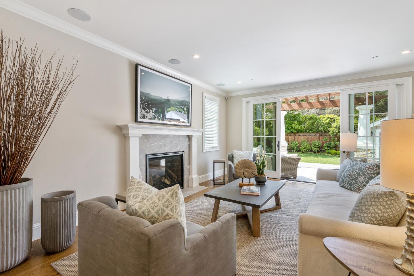 115 Occidental Avenue Burlingame, CA 94010 - Photo 15 of 50 a living room with furniture and a fireplace