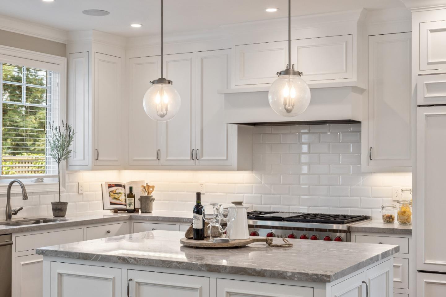 115 Occidental Avenue Burlingame, CA 94010 - Photo 19 of 50 a kitchen with a sink and cabinets