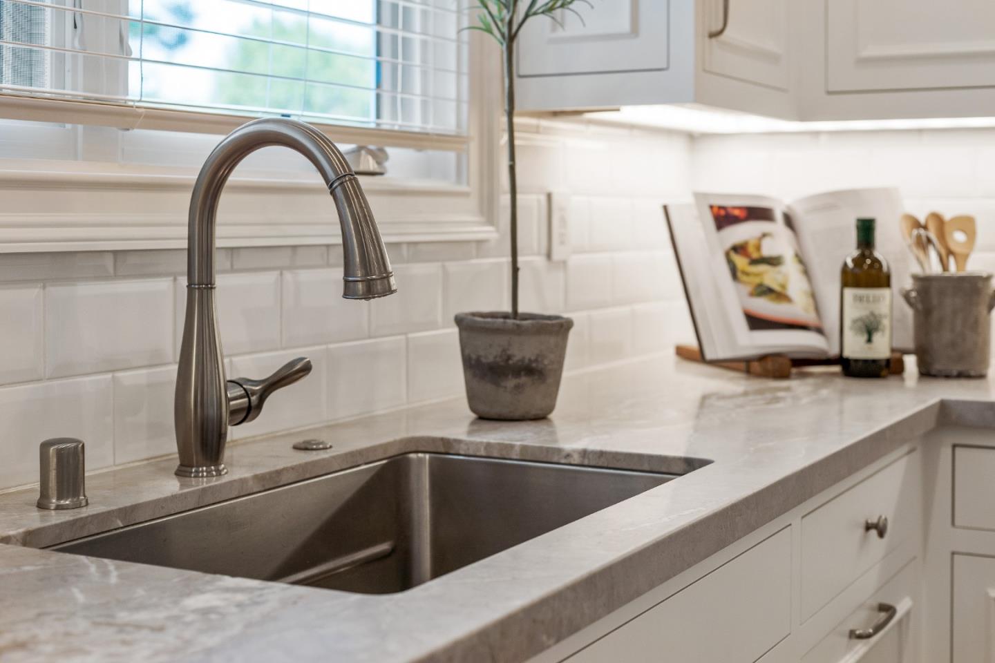 115 Occidental Avenue Burlingame, CA 94010 - Photo 21 of 50 a kitchen with a sink and a bathtub