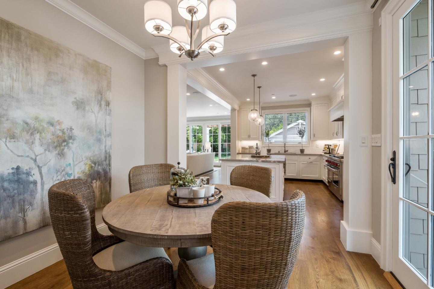 115 Occidental Avenue Burlingame, CA 94010 - Photo 22 of 50 a dining room with furniture a chandelier and wooden floor