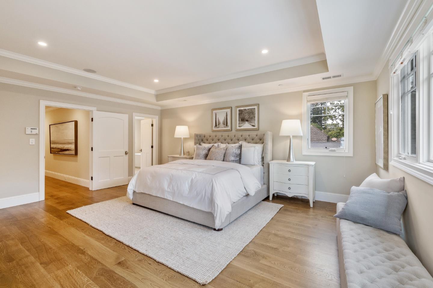 115 Occidental Avenue Burlingame, CA 94010 - Photo 33 of 50 a bedroom with a large bed and wooden floor