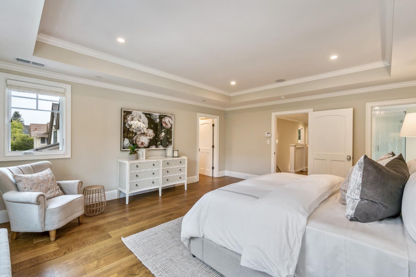 115 Occidental Avenue Burlingame, CA 94010 - Photo 34 of 50 a bedroom with a bed and wooden floor