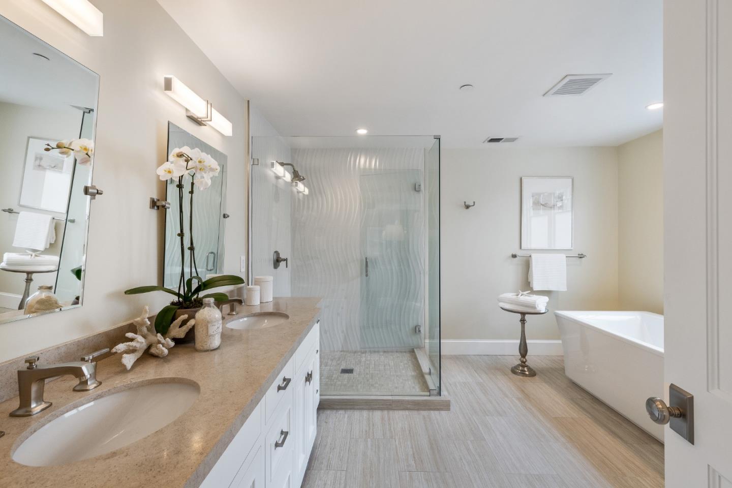 115 Occidental Avenue Burlingame, CA 94010 - Photo 35 of 50 a bathroom with a double vanity sink a toilet a mirror and shower