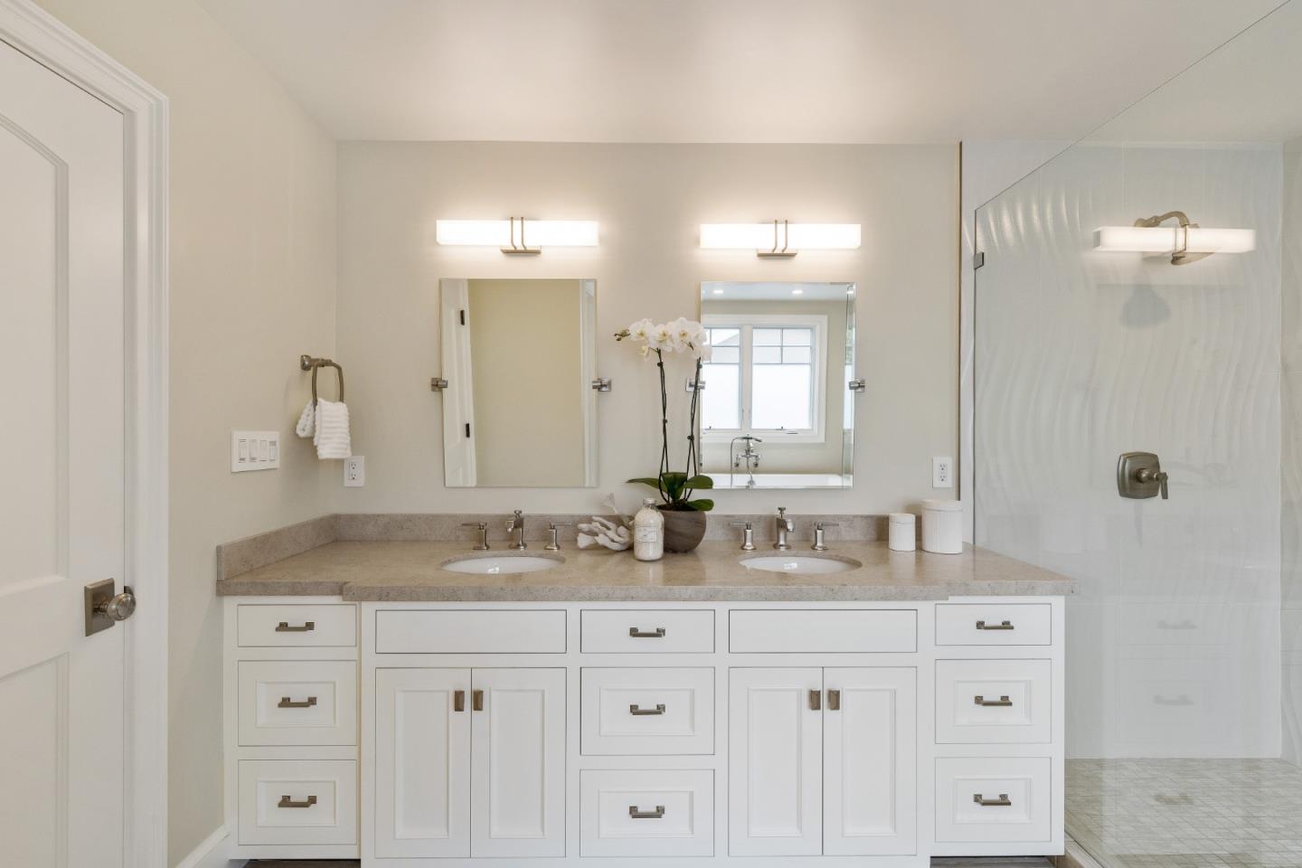 115 Occidental Avenue Burlingame, CA 94010 - Photo 36 of 50 a bathroom with a granite countertop sink mirror and double
