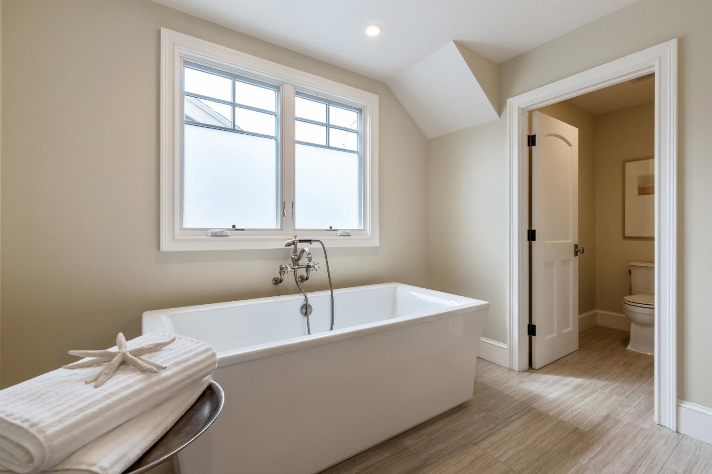 115 Occidental Avenue Burlingame, CA 94010 - Photo 39 of 50 a bath tub sitting in a bathroom next to a window