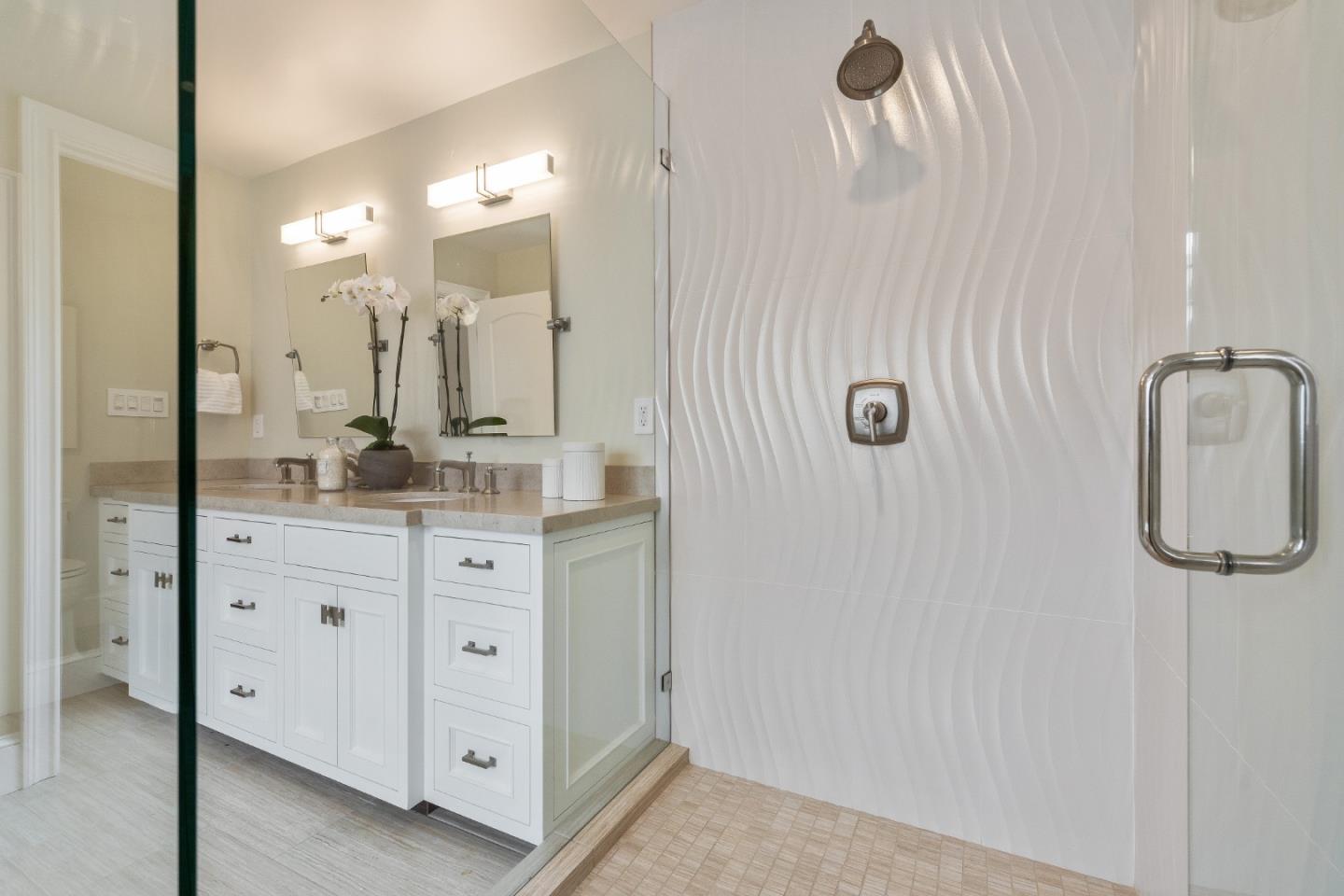 115 Occidental Avenue Burlingame, CA 94010 - Photo 41 of 50 a bathroom with a double vanity sink mirror and shower
