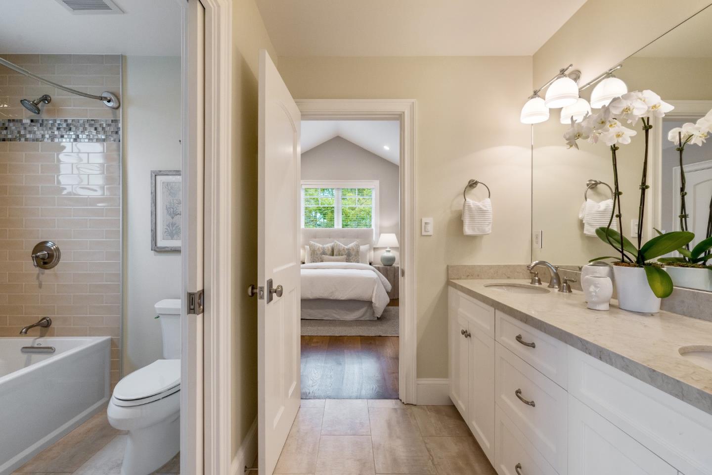 115 Occidental Avenue Burlingame, CA 94010 - Photo 47 of 50 a en suite spacious bathroom with a granite countertop sink a toilet a shower and a mirror