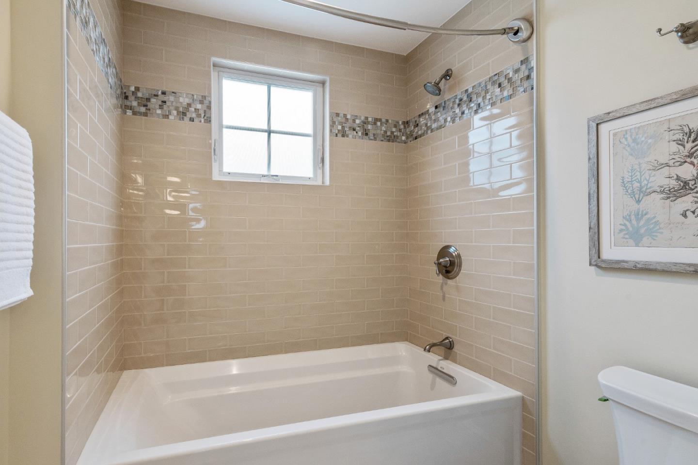 115 Occidental Avenue Burlingame, CA 94010 - Photo 48 of 50 a bathroom with a bathtub and shower