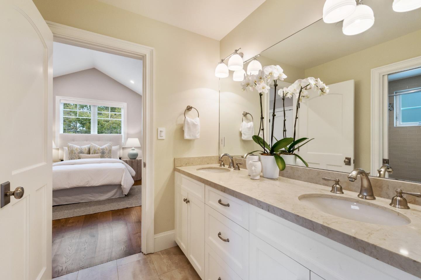 115 Occidental Avenue Burlingame, CA 94010 - Photo 49 of 50 a en suite bathroom with a double vanity sink and a mirror