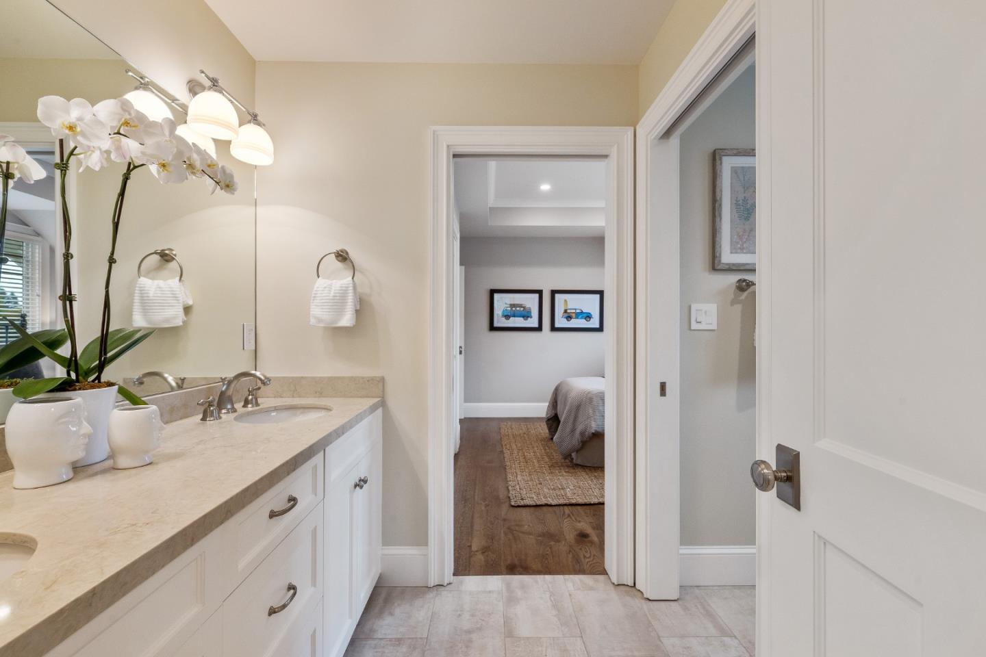115 Occidental Avenue Burlingame, CA 94010 - Photo 50 of 50 a bathroom with a sink a vanity and a mirror