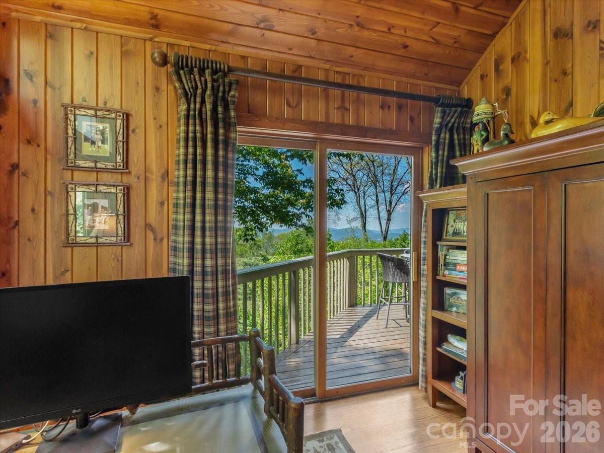 121 Ivy Ridge Road Burnsville, NC 28714 - Photo 19 of 48 a porch with a bench next to a window