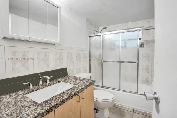 a bedroom with a bed furniture and a window