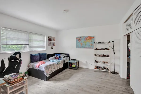 a living room with fireplace furniture and a flat screen tv