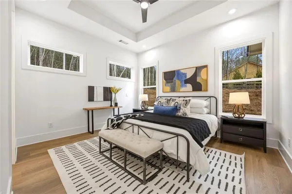 a bedroom with furniture and a window