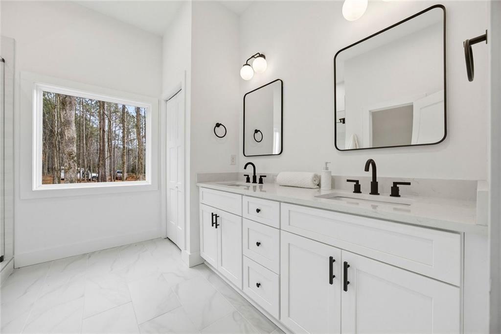730 Primrose Lane Pendergrass, GA 30567 - Photo 35 of 40 a spacious bathroom with double sink and a mirror