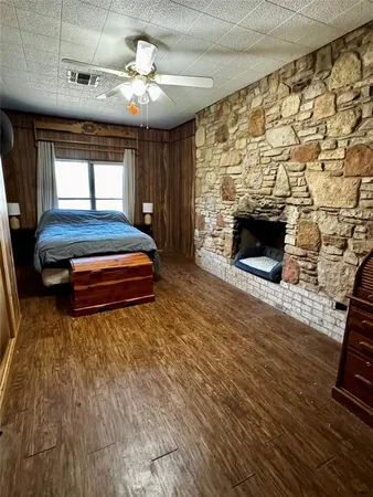 a living room with fireplace furniture and a fireplace