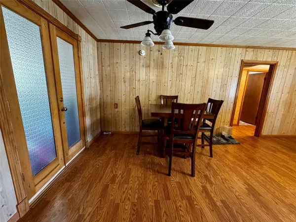 a view of a dining room with furniture and window
