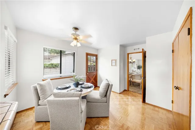 a dining room with furniture and window