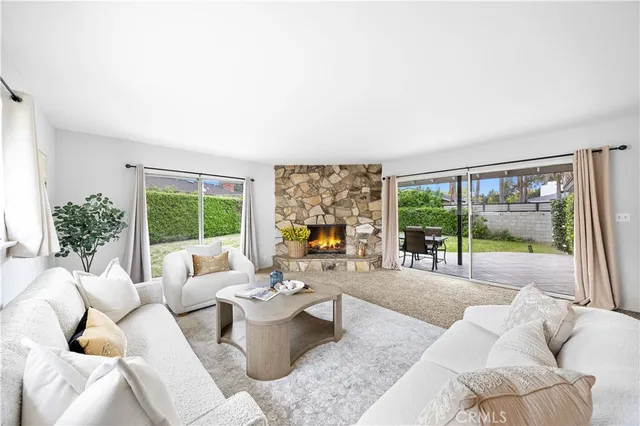 a living room with furniture large window and outer view