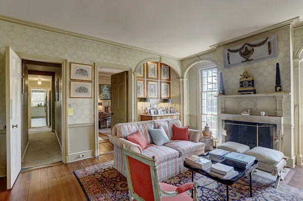 a living room with furniture and a fireplace