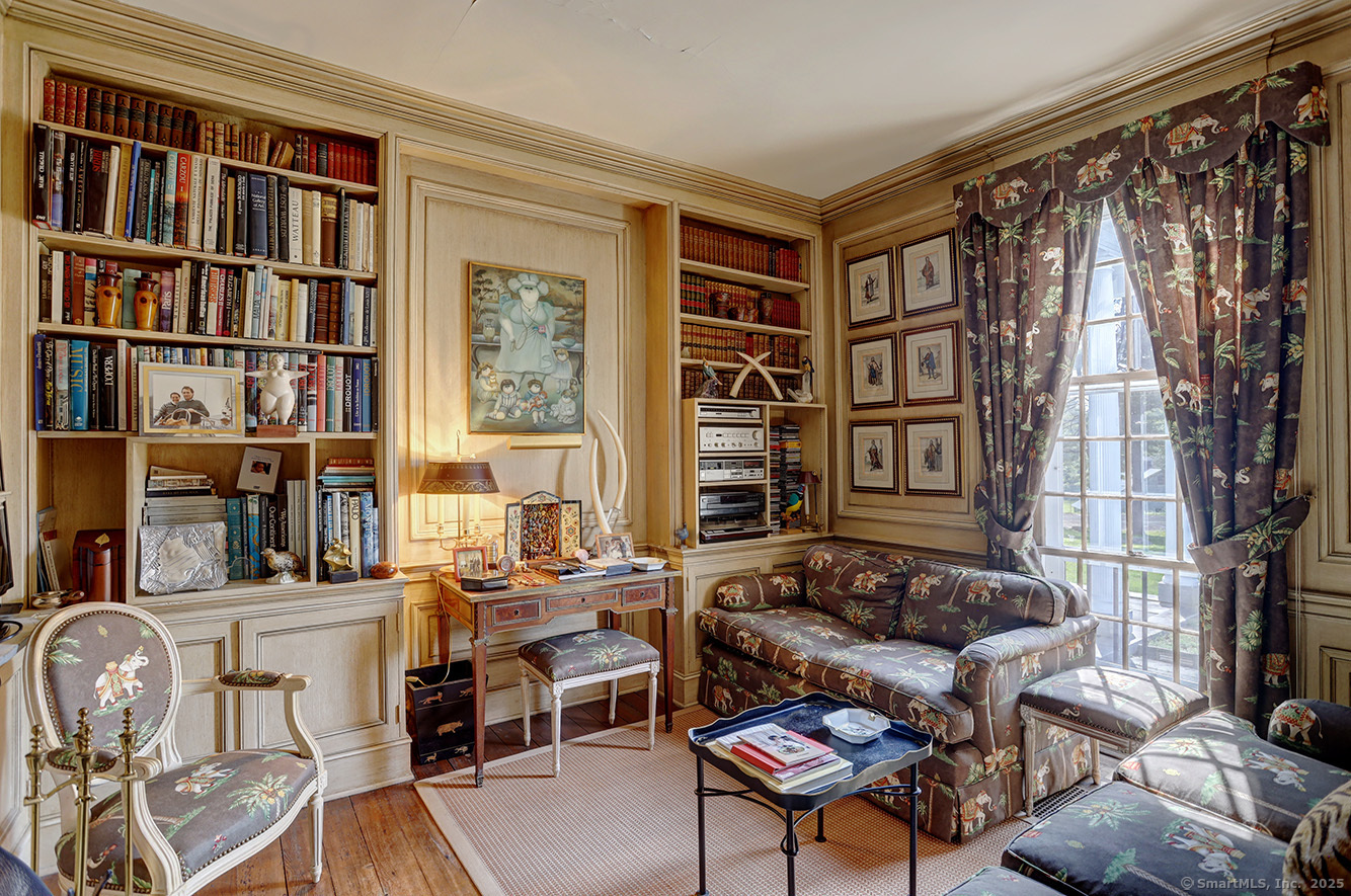 127 Old Goshen Road Norfolk, CT 06058 - Photo 17 of 32 a living room with furniture a bookshelf and a window