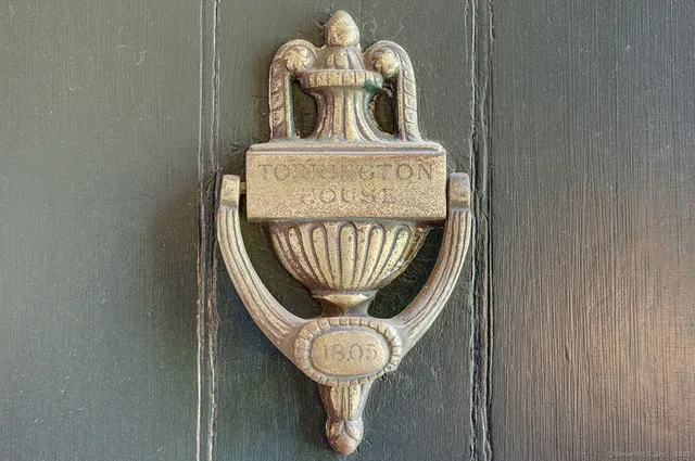 a close view of dining table with wooden floor