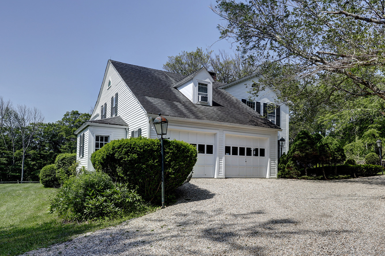 127 Old Goshen Road Norfolk, CT 06058 - Photo 31 of 32 a front view of a house with garden