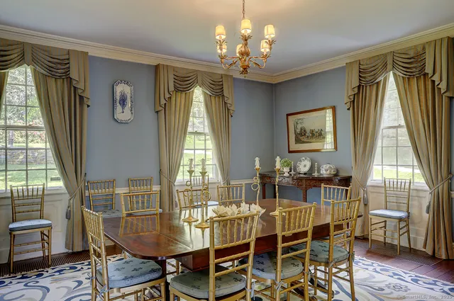a view of a dining room with furniture window and outside view