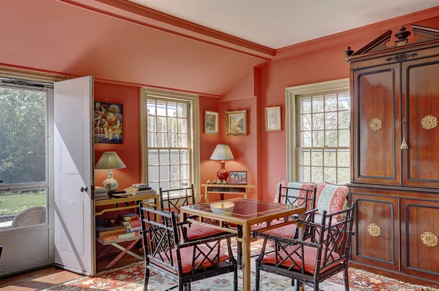 a view of a dining room with furniture window and outside view
