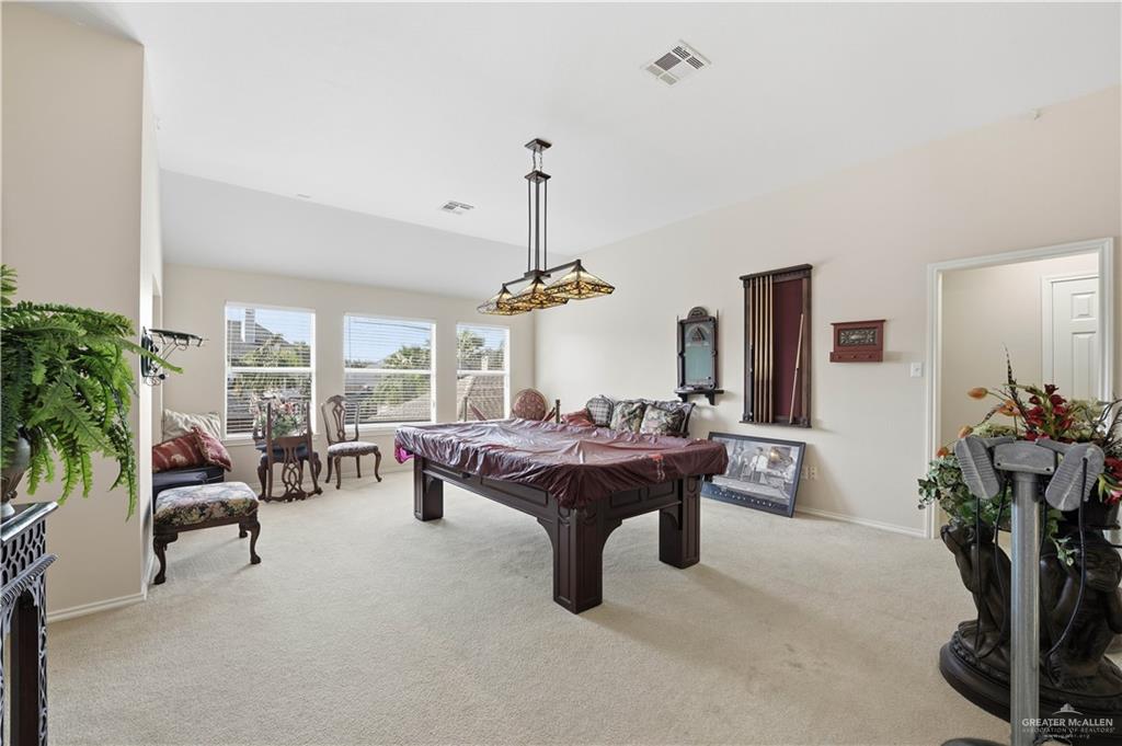 2804 Santa Lydia Street Mission, TX 78572 - Photo 12 of 18 a living room with furniture a chandelier and a dining table