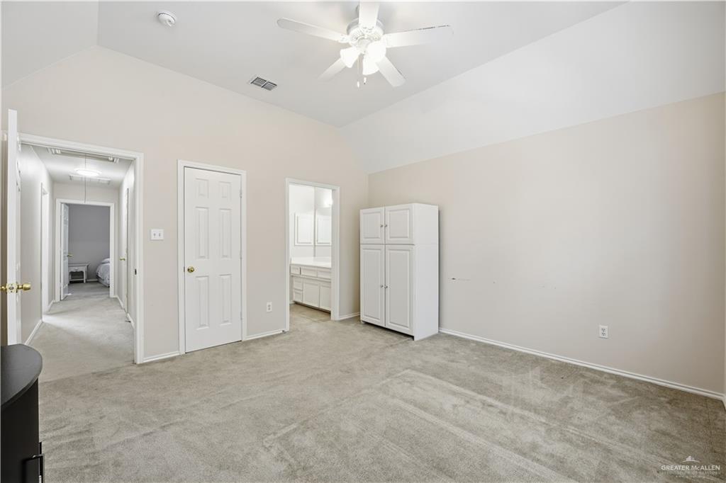 2804 Santa Lydia Street Mission, TX 78572 - Photo 16 of 18 an empty room with closet and a ceiling fan