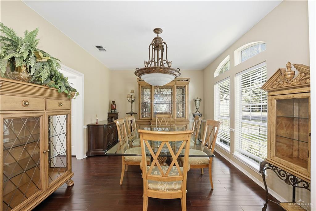 2804 Santa Lydia Street Mission, TX 78572 - Photo 5 of 18 a view of a dining room with furniture window and wooden floor