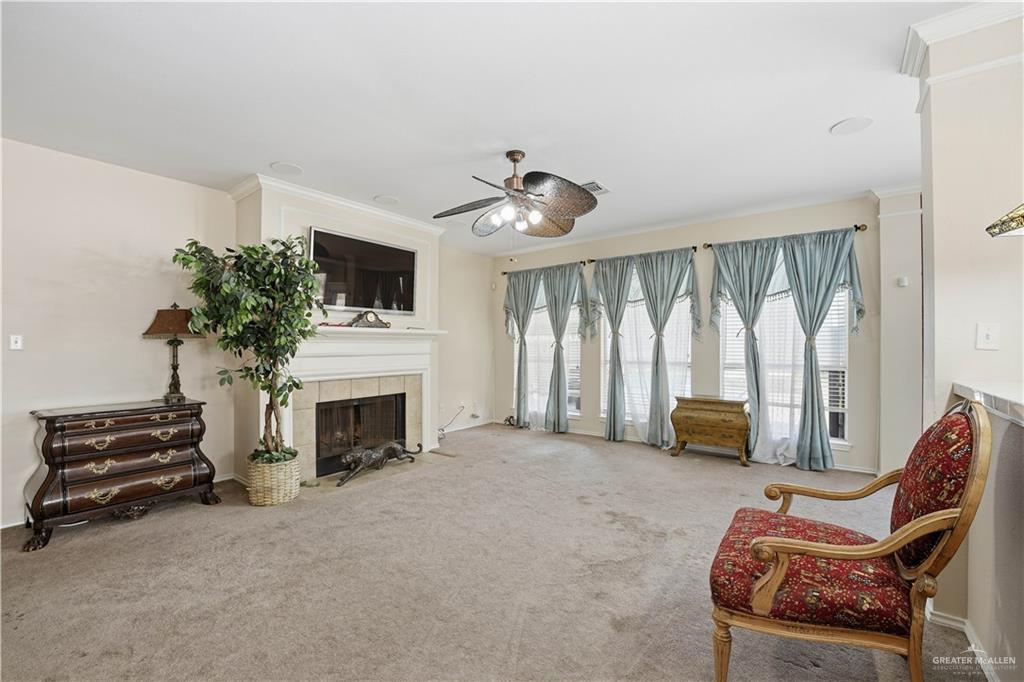 2804 Santa Lydia Street Mission, TX 78572 - Photo 6 of 18 a living room with furniture a fireplace and a large window