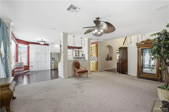 a kitchen with stainless steel appliances a refrigerator a stove a sink and a wooden floors