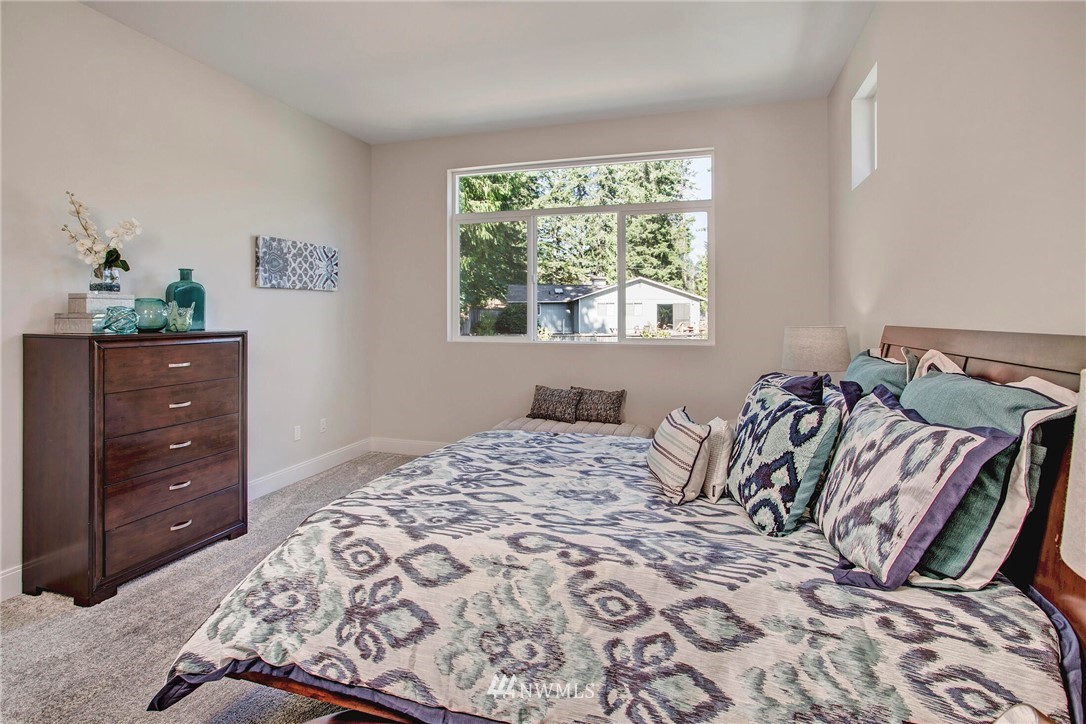 22222 17th Avenue West, Unit 8 Bothell, WA 98021 - Photo 15 of 38 a bedroom with a bed and a window