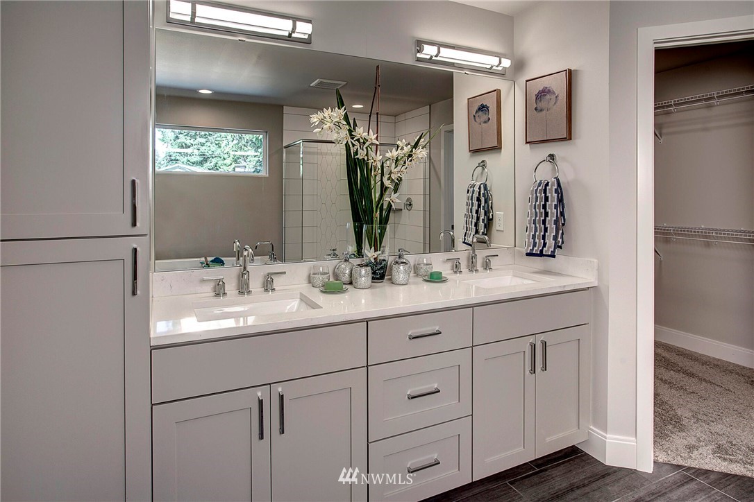 22222 17th Avenue West, Unit 8 Bothell, WA 98021 - Photo 16 of 38 a bathroom with a double vanity sink and mirror