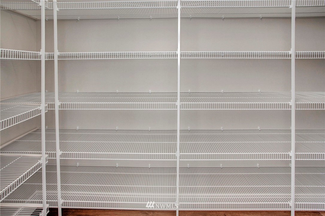 22222 17th Avenue West, Unit 8 Bothell, WA 98021 - Photo 19 of 38 a view of walk in closet with empty racks