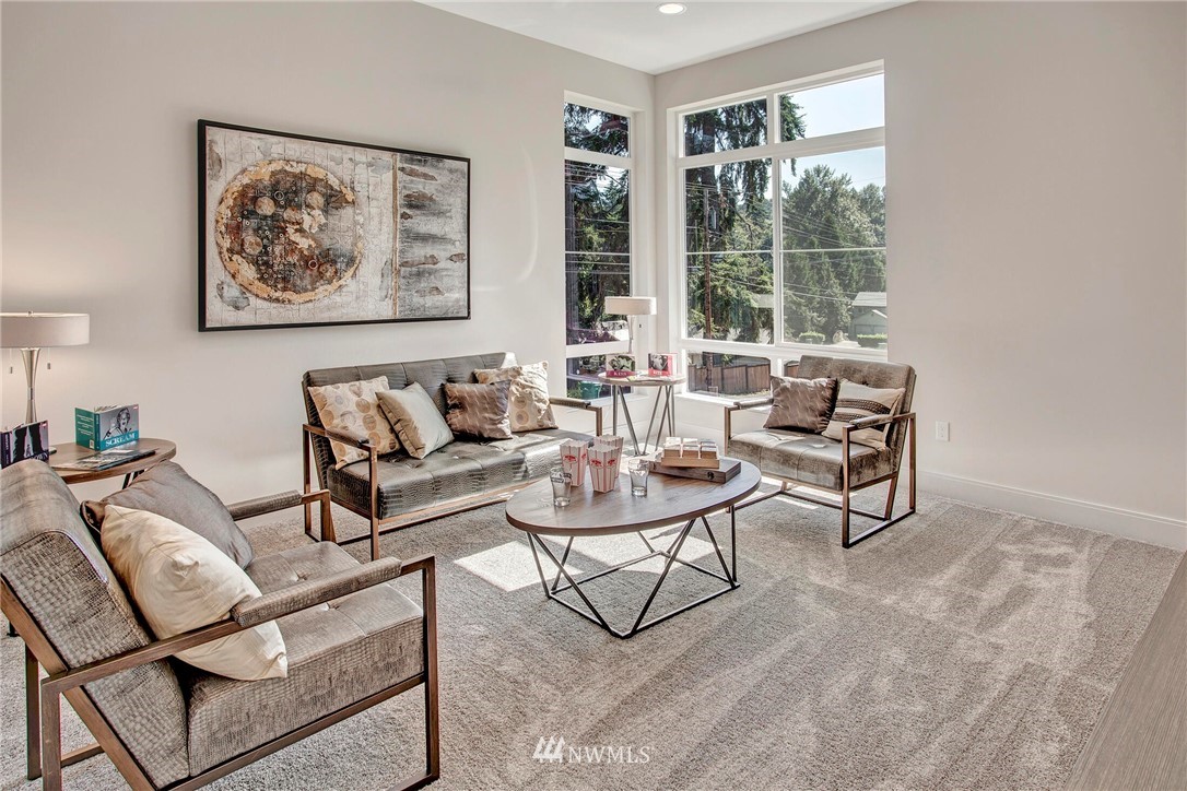 22222 17th Avenue West, Unit 8 Bothell, WA 98021 - Photo 23 of 38 a living room with furniture and a large window