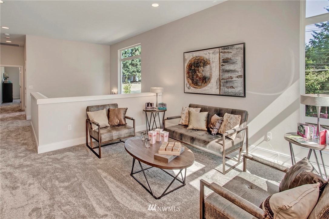 22222 17th Avenue West, Unit 8 Bothell, WA 98021 - Photo 24 of 38 a living room with furniture and painting on the wall