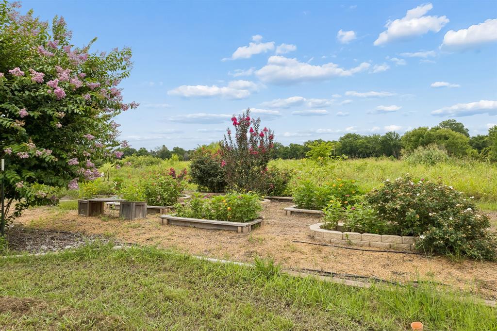 62 Trail Ridge Drive Melissa, TX 75454 - Photo 33 of 39 Outdoor garden area featuring multiple raised beds and irrigation system