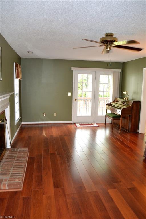 3313 Timberwolf Avenue High Point, NC 27265 - Photo 4 of 25 Living room opens up to nice deck overlooking the beautiful backyard. Lots of natural light make this room even more inviting.