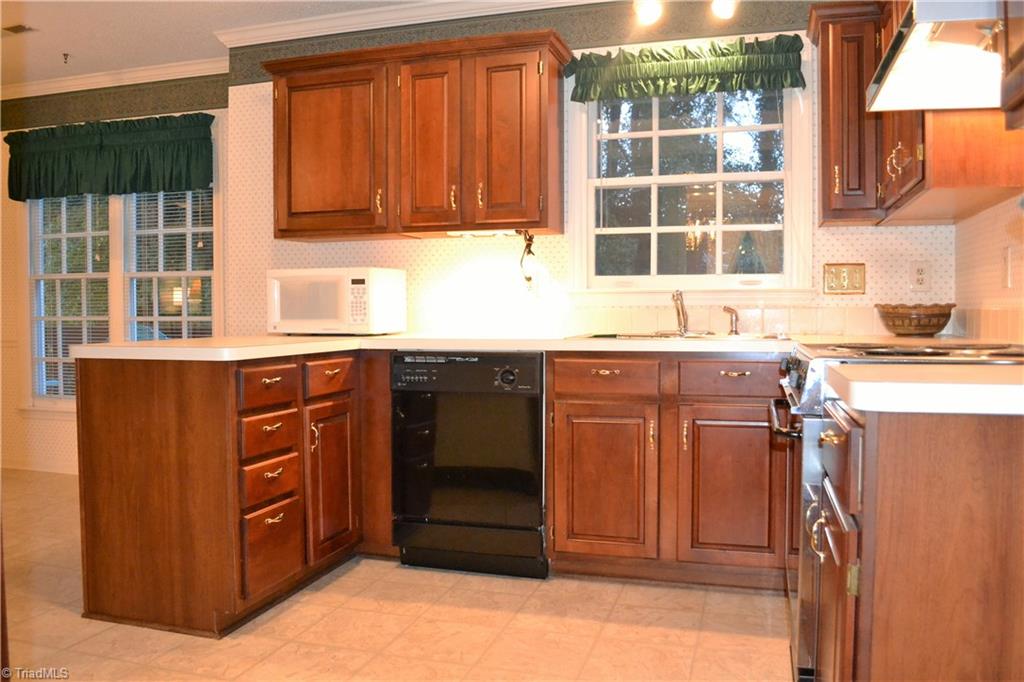 3313 Timberwolf Avenue High Point, NC 27265 - Photo 8 of 25 The kitchen overlooks the backyard and has considerable cabinet space.