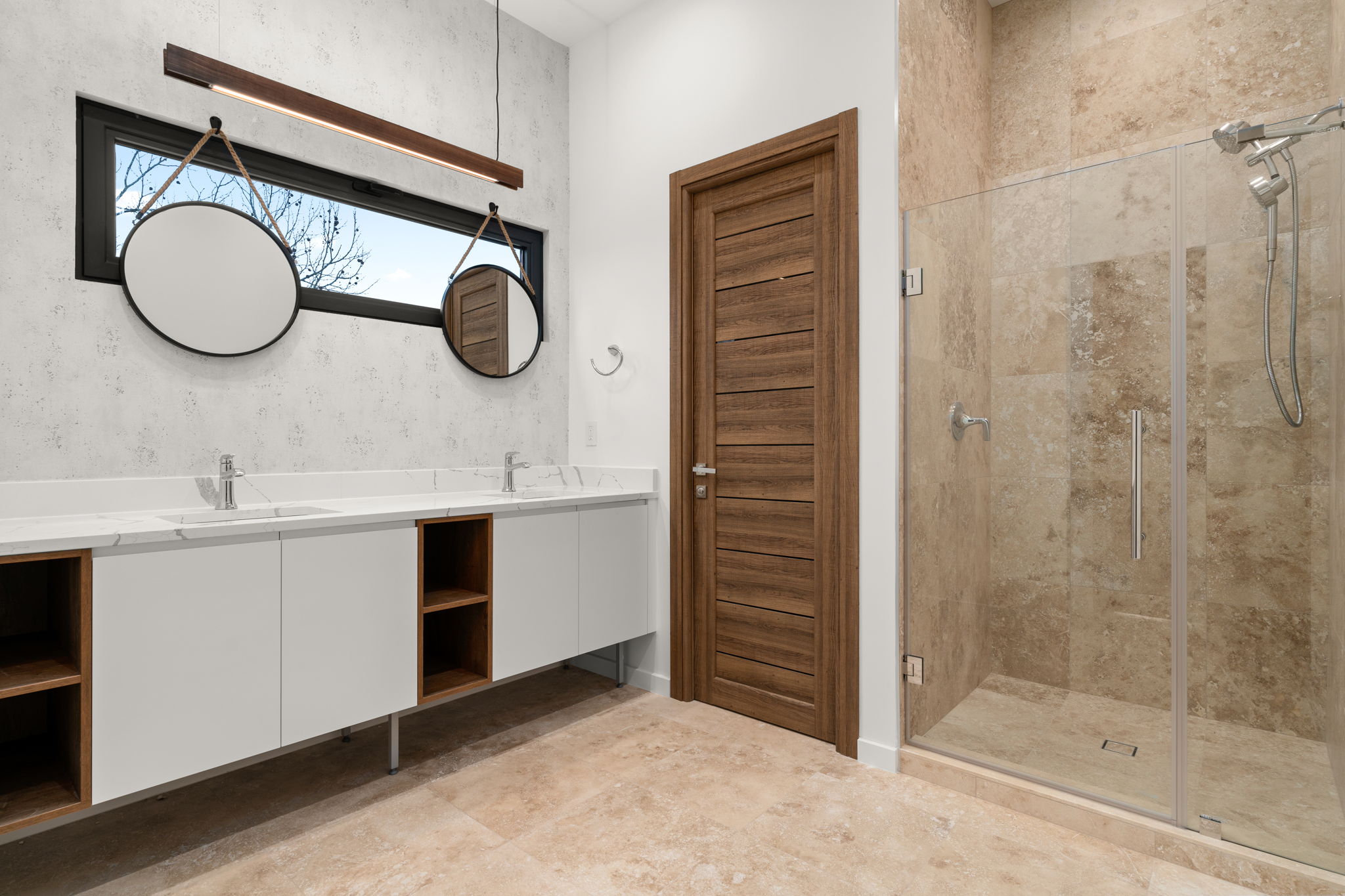 2915 Chisholm Trail Austin, TX 78734 - Photo 26 of 35 a bathroom with a mirror a sink and a mirror
