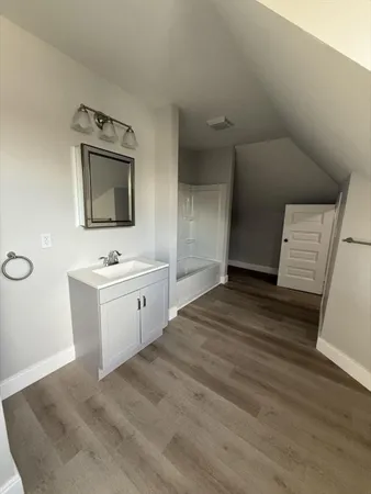 a view of washer and dryer with wooden floor